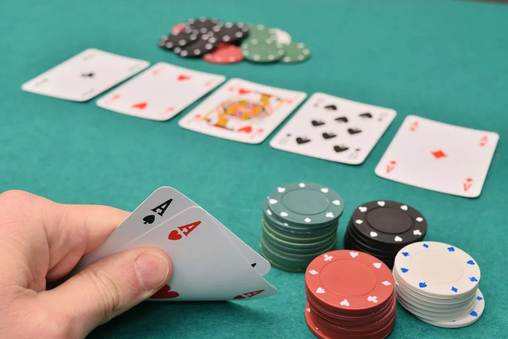 hand-holding-up-a-pair-of-playing-cards-game-of-Texas-Hold-Em-poker